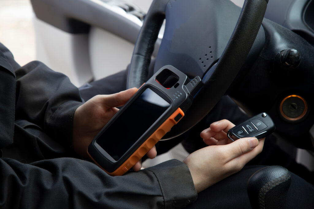 Car key programming equipment and new keys on workbench
